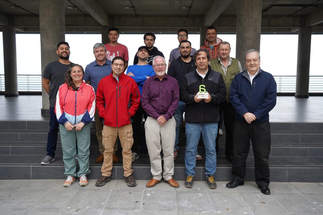 The CHEX team with academic and award representatives, holding the 2024 Avonni Award for Energy